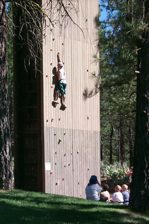 Kids on a climbing wall at camp