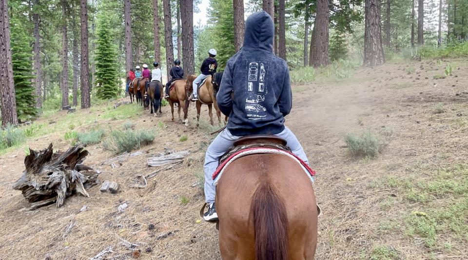 riding horses at summer camp