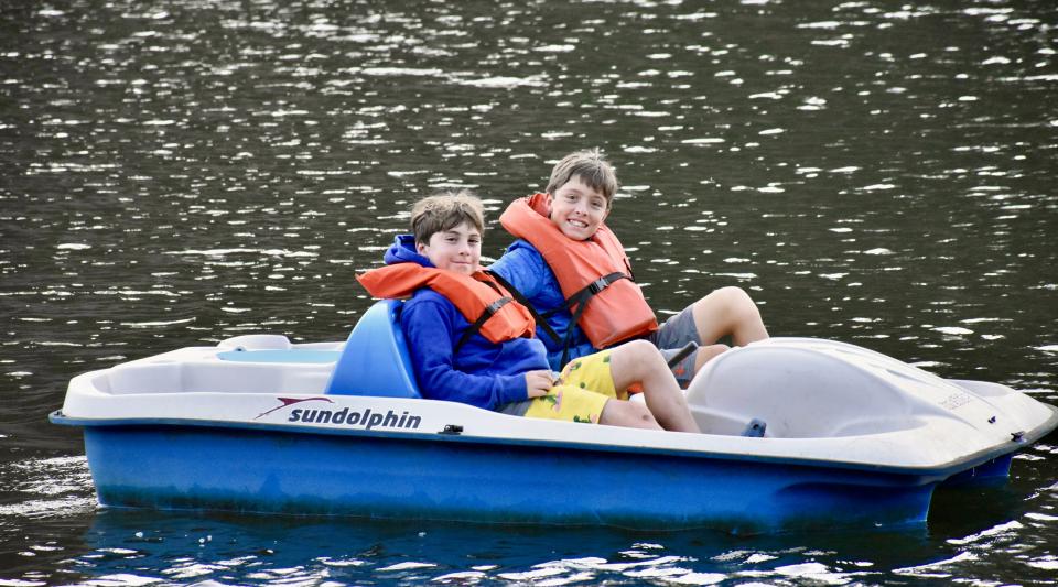 peddle boats on private summer camp lake
